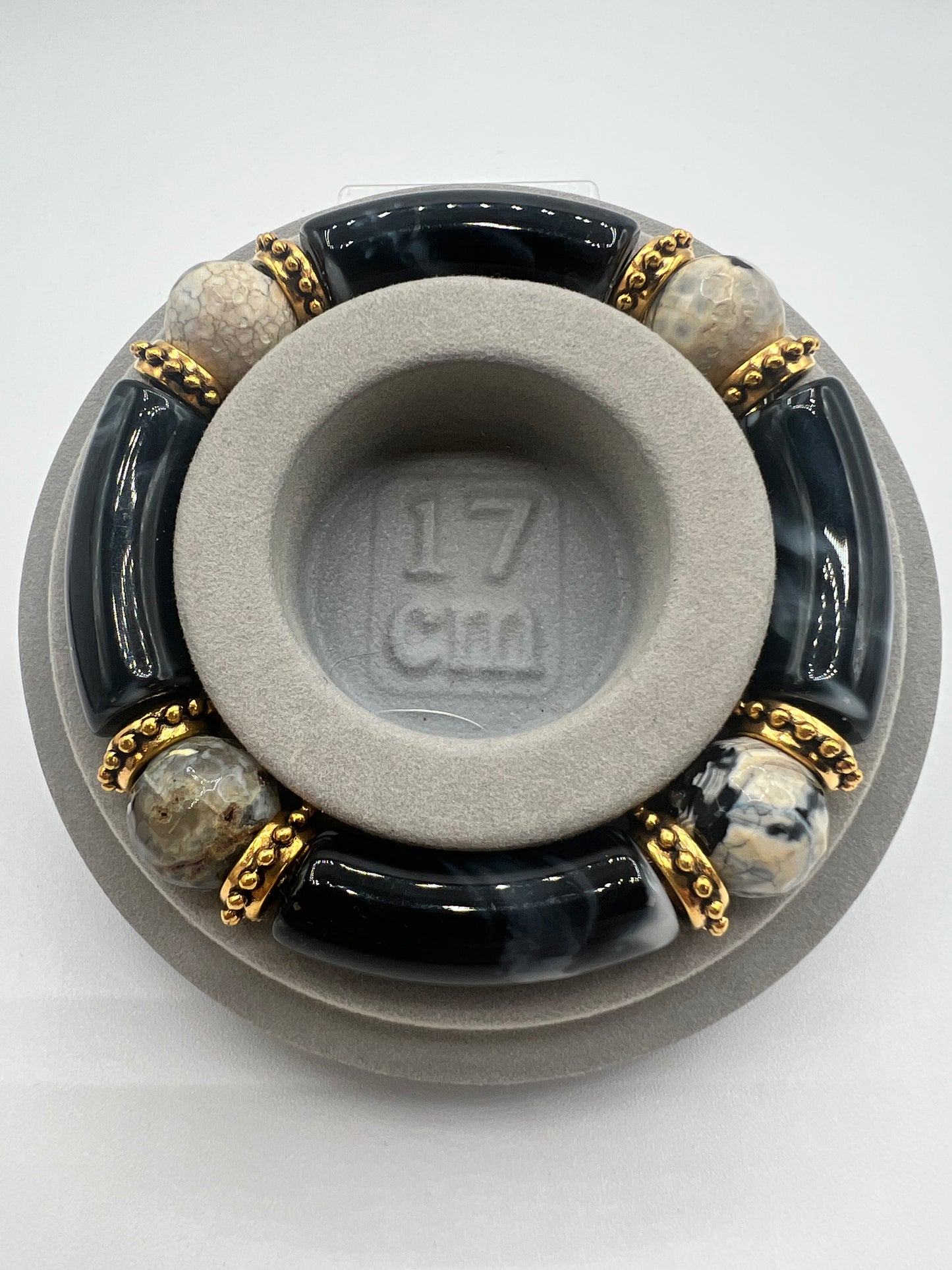 Black Acrylic Tube Bangle with 14 mm Firecracker Agate Beads Accented in Gold.