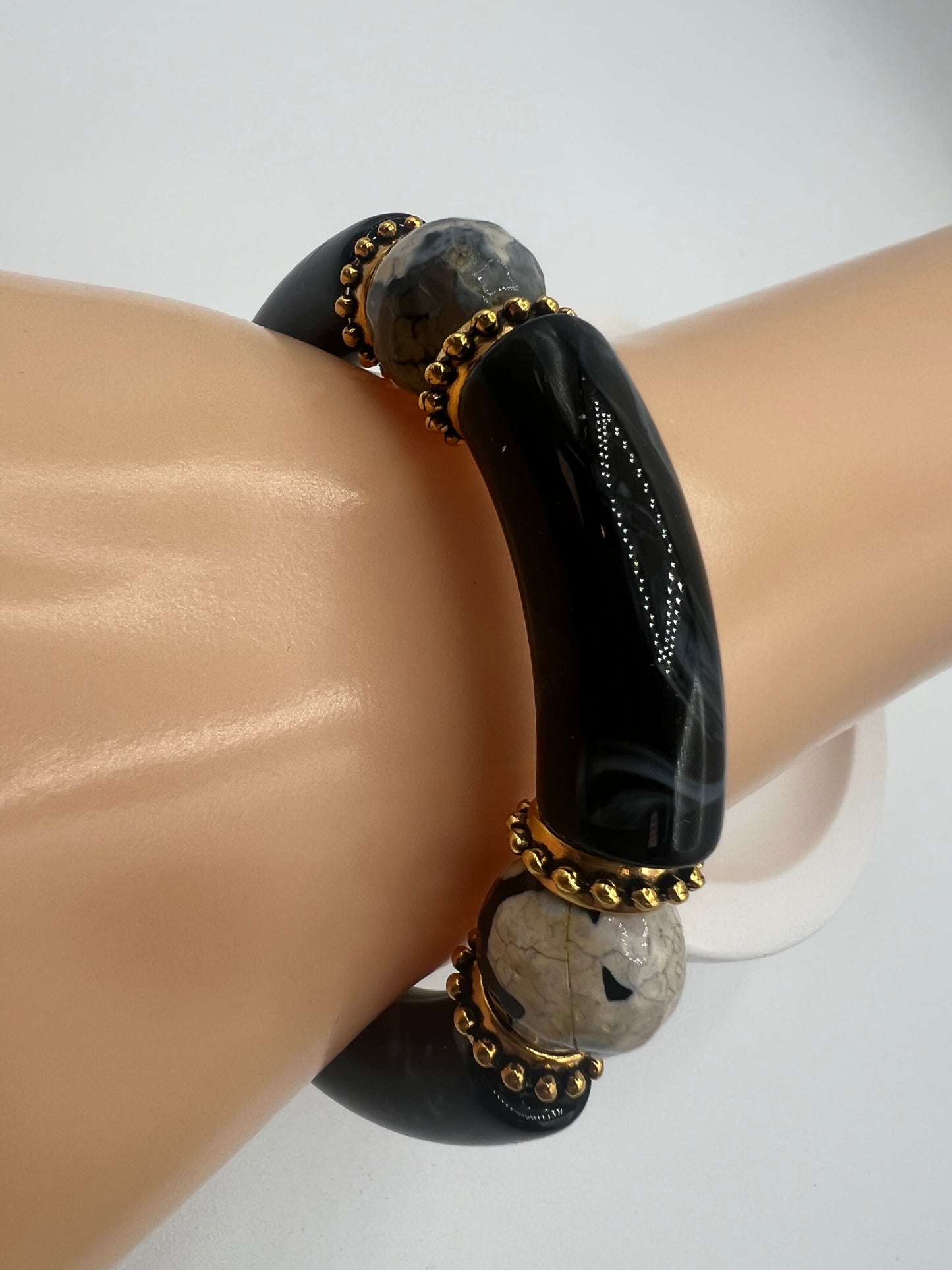 Black Acrylic Tube Bangle with 14 mm Firecracker Agate Beads Accented in Gold.